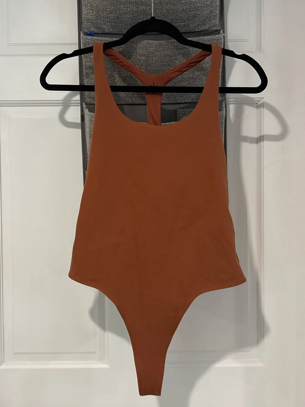 Alo Yoga Sleek Back Bodysuit in Rust Large